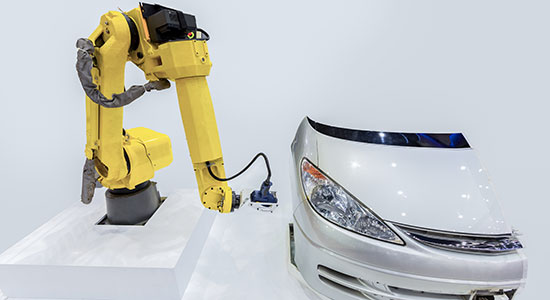 Industrial robot with a vision system performs noncontact inspection of vehicle surfaces in automotive production