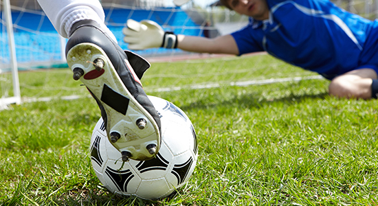 Soccer on the goal line in front of the goal—an example of a precise “in-and-out” call using camera systems